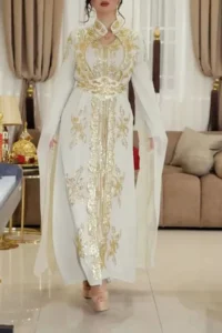 Elegant Beige Moroccan wedding kaftan with intricate gold embroidery, long sleeves, and a flowing cape, designed for brides and special occasions. A perfect blend of tradition and modern luxury (5)