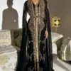 Elegant black Moroccan kaftan abaya with gold embroidery, sheer sleeves, and a matching belt, perfect for formal events and celebrations (1)