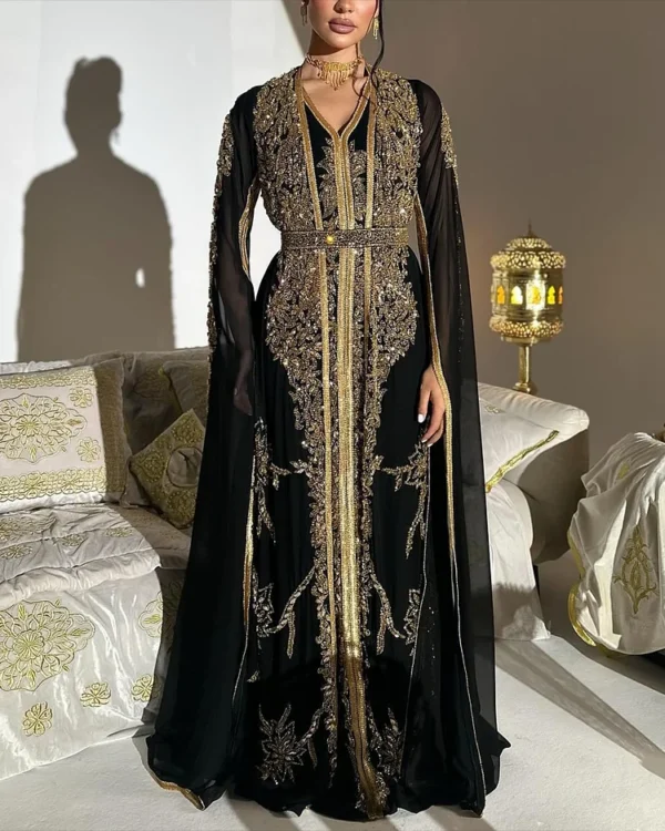Elegant black Moroccan kaftan abaya with gold embroidery, sheer sleeves, and a matching belt, perfect for formal events and celebrations (1)
