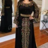 Black velvet Moroccan style kaftan dress with colorful floral embroidery and woven waist belt (1)